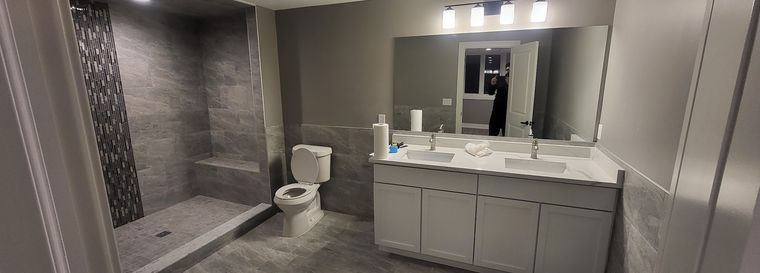 Shower glass and vanity mirror in one visit