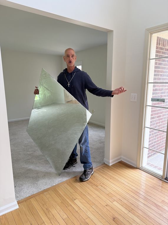 Carrying a fresh sheet into the house