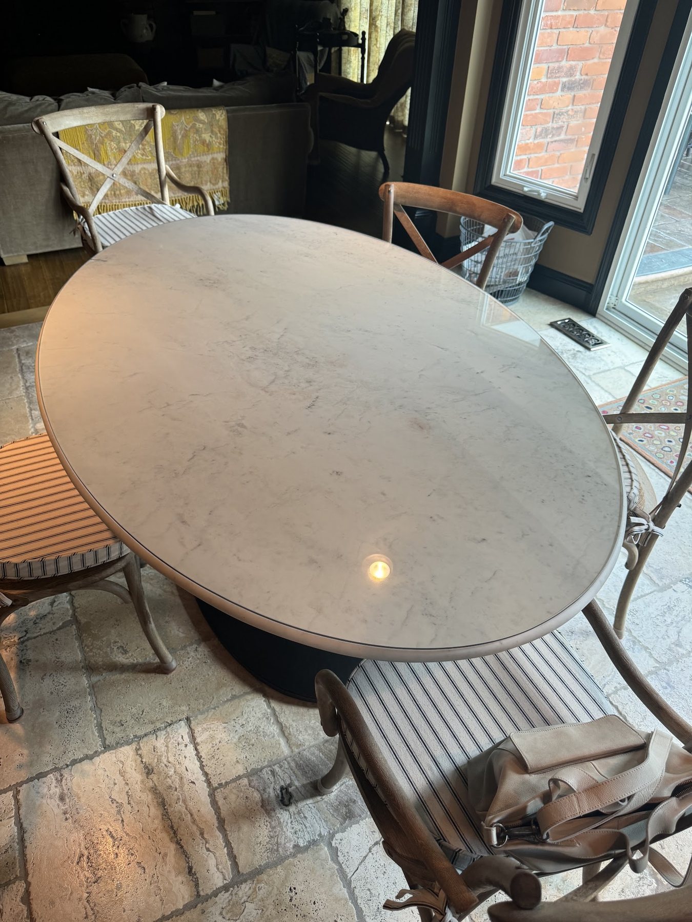 Round glass top on a patio dining table