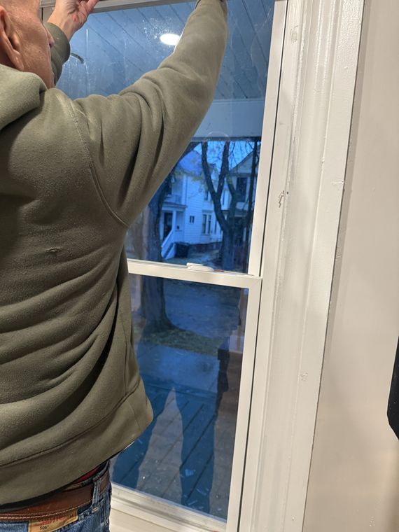 Setting a new pane of glass into a window frame