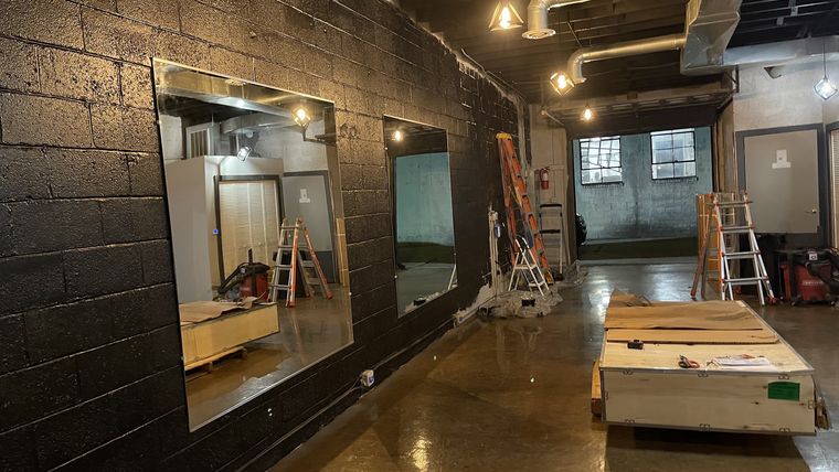 Large commercial mirror installed in an open industrial space