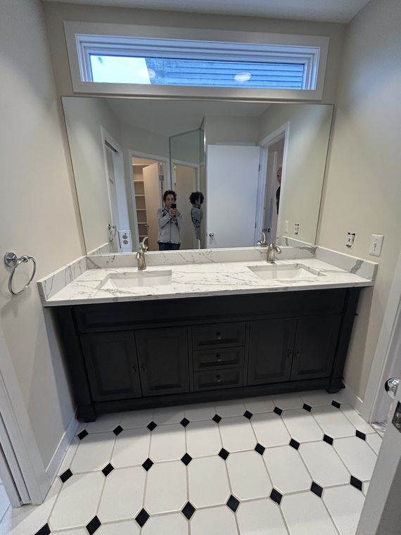 Frameless mirror above a double vanity