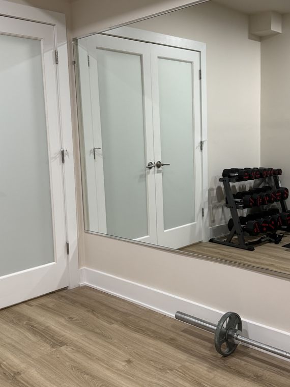Mirror beside french doors in a gym