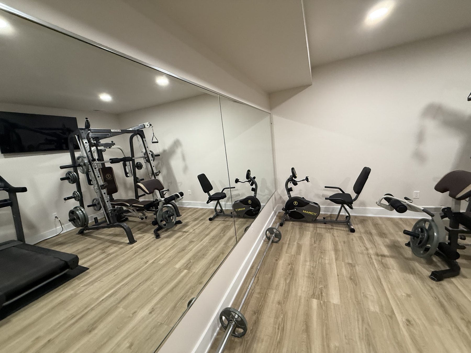 Full-wall mirror installed in a home gym