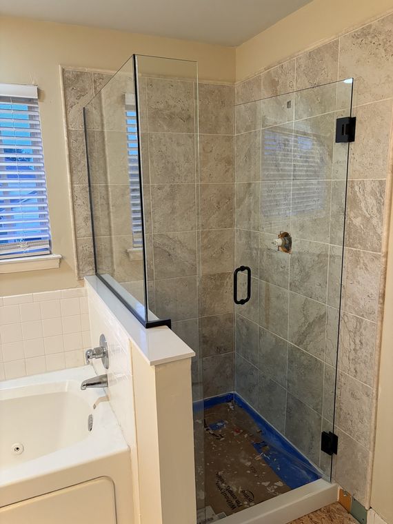 Glass panel over a soaking tub