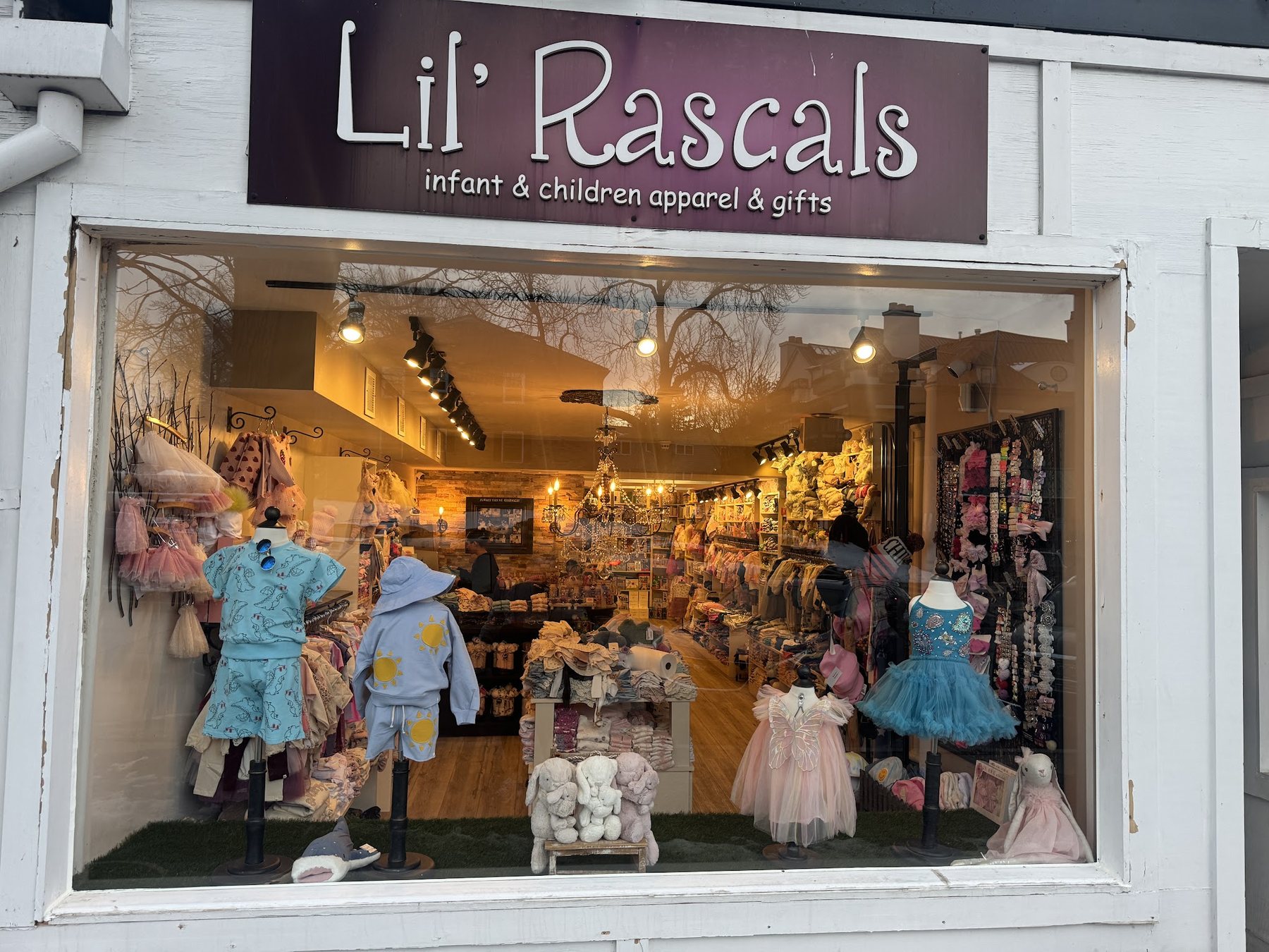 Replaced storefront window at a children's clothing boutique
