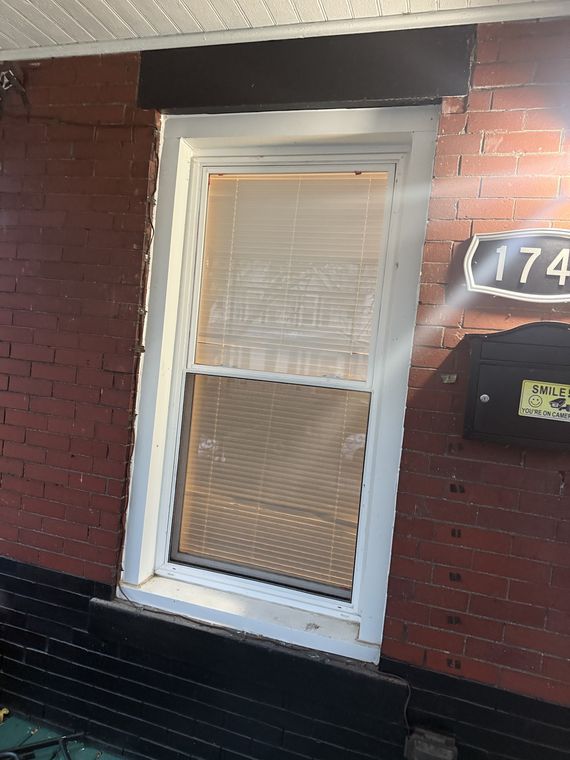 Window glass in a brick building
