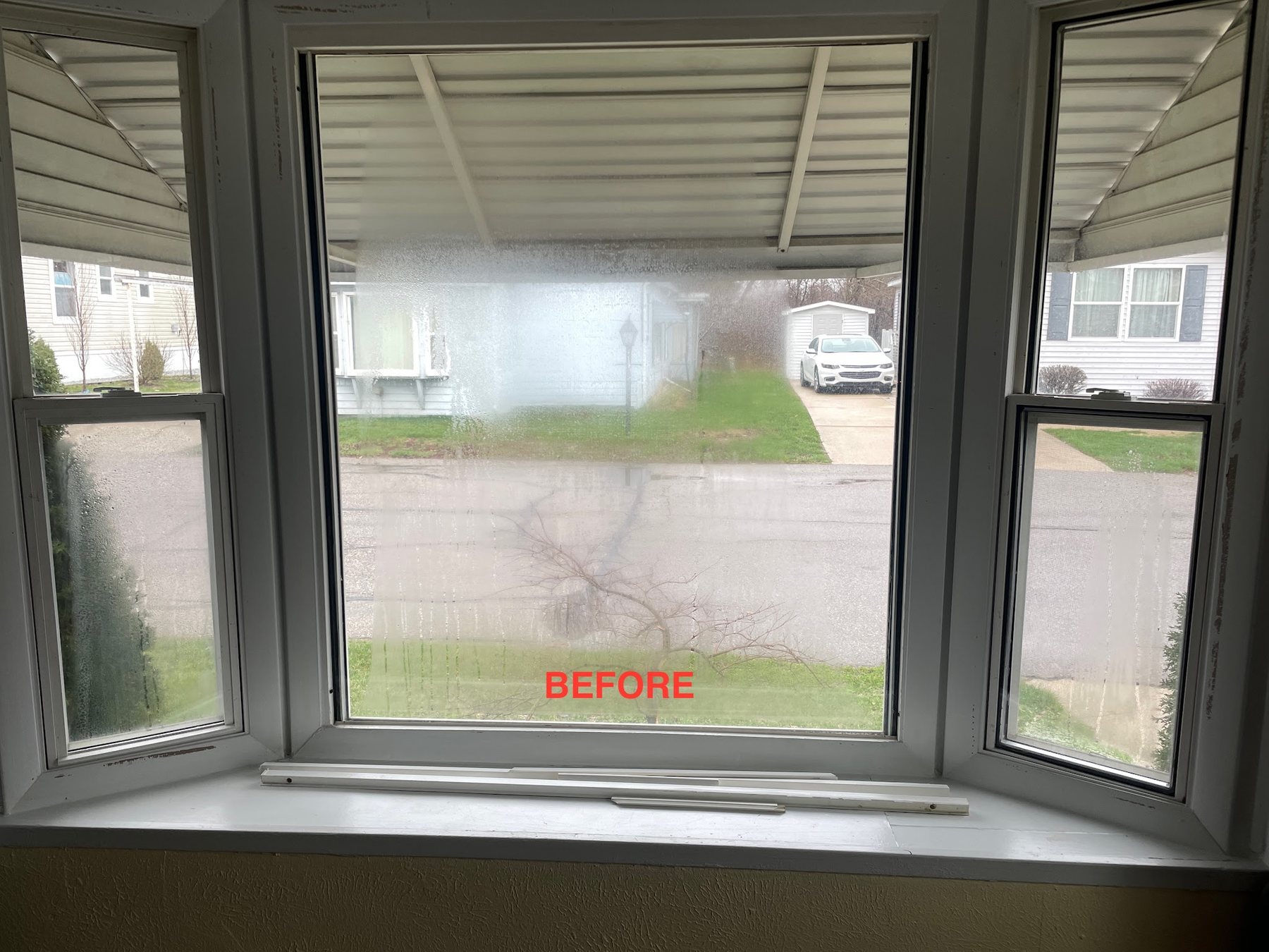Bay window with a failed seal, fogged and clouded